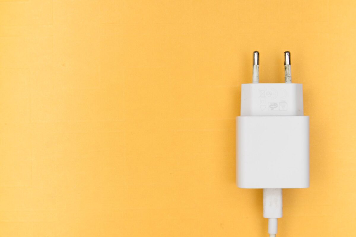 electric plug on yellow background